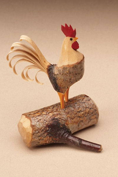 Whittling A Branch Rooster –